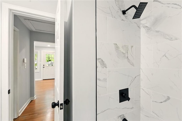 163 Oakcliff Ct, South Fulton, GA 30331 - bathroom featuring a shower, wood finished floors, and baseboards