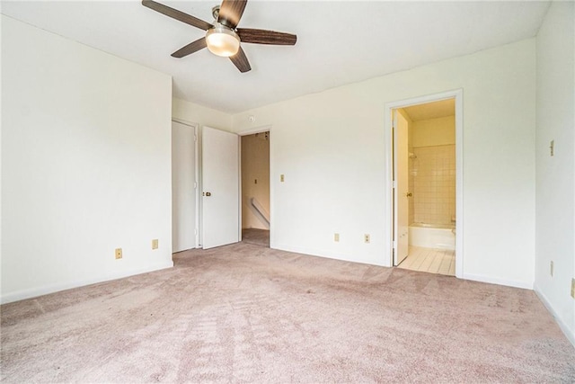 unfurnished bedroom with light carpet, ensuite bath, and ceiling fan