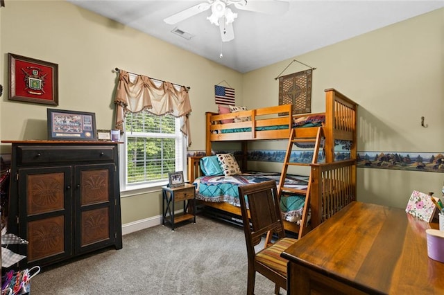 bedroom featuring baseboards, a ceiling fan, visible vents, and carpet