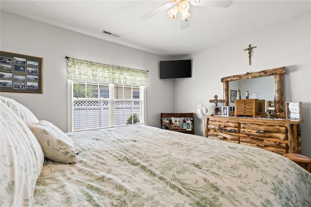 bedroom featuring visible vents and ceiling fan