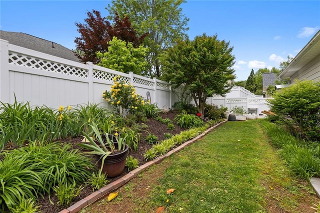 view of yard with a fenced backyard
