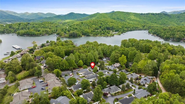 bird's eye view featuring a residential view, a wooded view, and a water and mountain view
