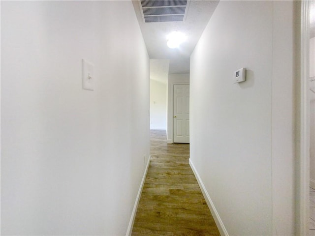 hallway featuring hardwood / wood-style floors