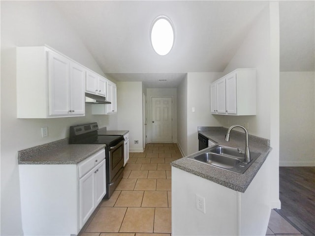 kitchen with white cabinetry, light tile patterned floors, sink, and electric stove