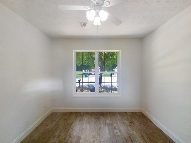 unfurnished room featuring hardwood / wood-style flooring and ceiling fan