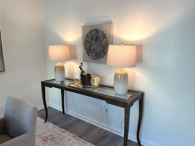 room details with baseboards and wood finished floors