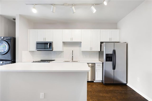 5300 Peachtree Rd Unit 3207, Chamblee, GA 30341 - kitchen with appliances with stainless steel finishes, rail lighting, and white cabinets