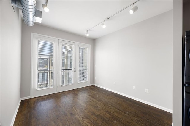 5300 Peachtree Rd Unit 3207, Chamblee, GA 30341 - unfurnished room featuring track lighting, dark wood-type flooring, and french doors