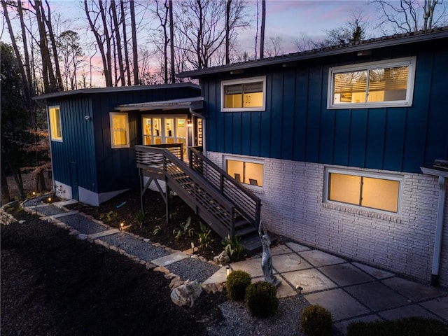 view of back house at dusk