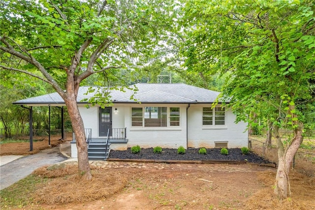 view of front of home featuring a carport and covered porch