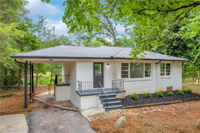 view of front facade with a carport