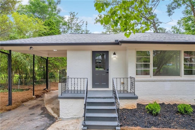 entrance to property with a carport