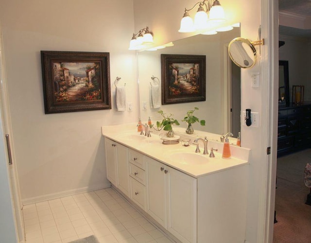 full bath featuring baseboards, double vanity, a sink, and tile patterned floors