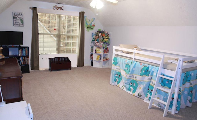 carpeted bedroom with vaulted ceiling