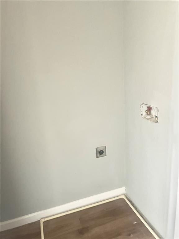 laundry area featuring electric dryer hookup, washer hookup, and hardwood / wood-style flooring