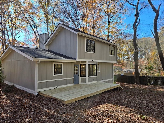 rear view of house featuring a deck