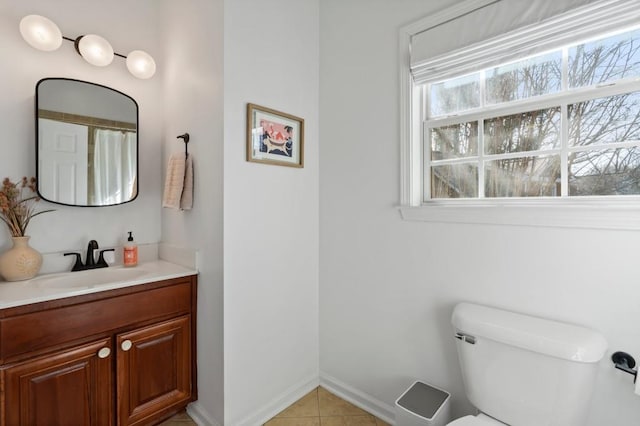 full bath featuring vanity, tile patterned floors, toilet, and baseboards