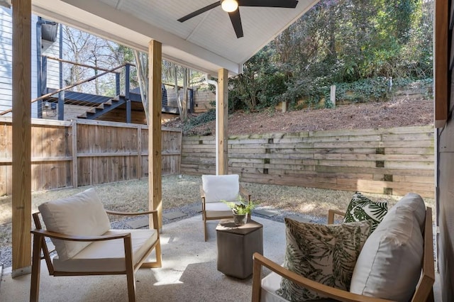 view of patio / terrace featuring a fenced backyard, stairway, and ceiling fan