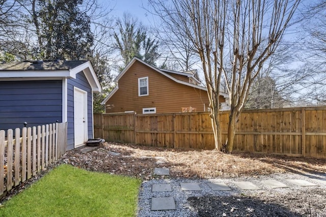 view of yard with an outdoor structure and fence