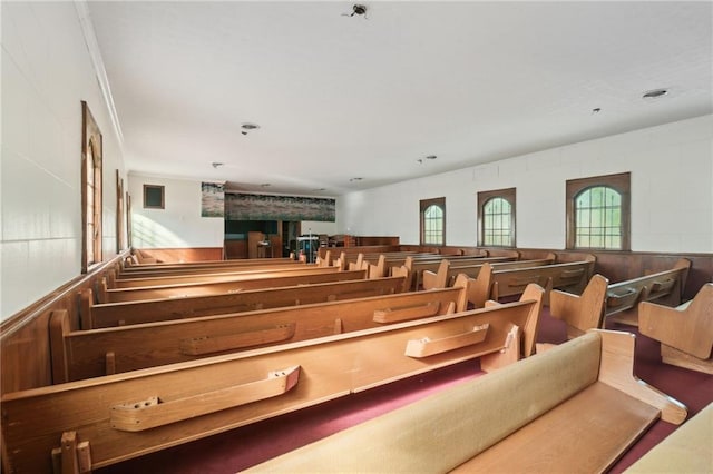 recreation room featuring crown molding