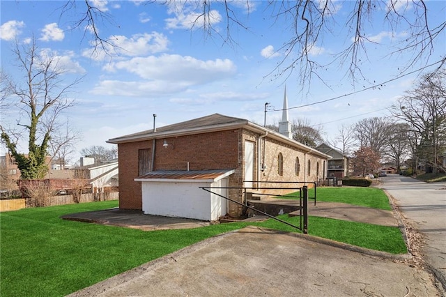 view of home's exterior with a lawn