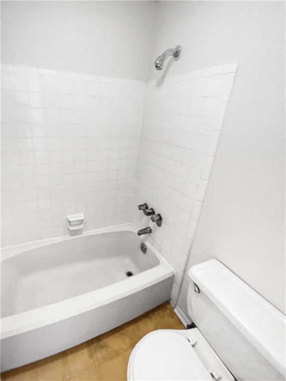 bathroom featuring toilet and bathtub / shower combination