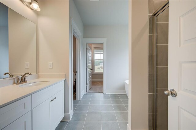 full bathroom featuring tile patterned floors, vanity, toilet, and independent shower and bath