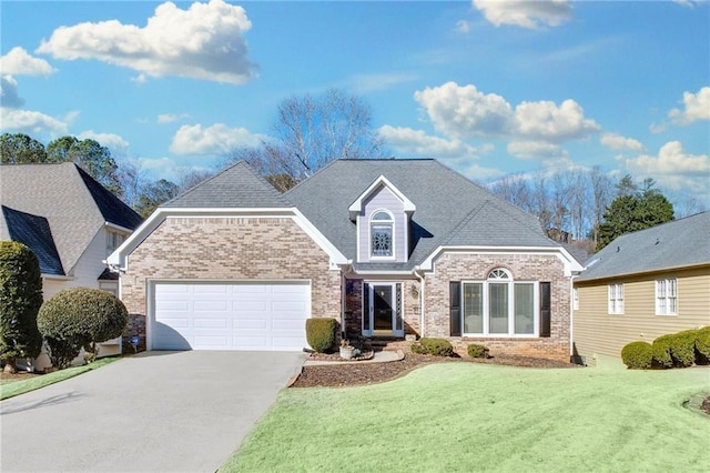 front of property featuring a front lawn and a garage