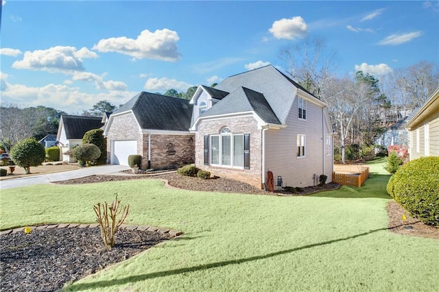 front of property featuring a garage and a front lawn