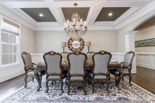 dining room with ornate columns, hardwood / wood-style flooring, coffered ceiling, and ornamental molding