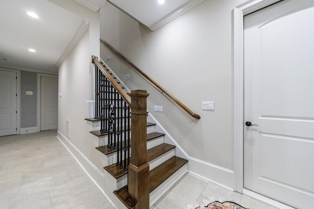 stairway with tile patterned flooring and ornamental molding