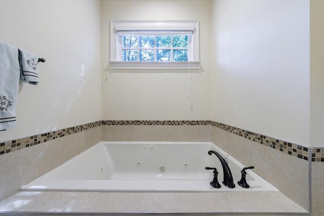 bathroom with tiled bath