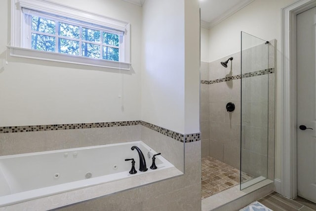 bathroom featuring crown molding and shower with separate bathtub