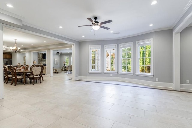 tiled living room featuring ceiling fan with notable chandelier, ornamental molding, and a healthy amount of sunlight