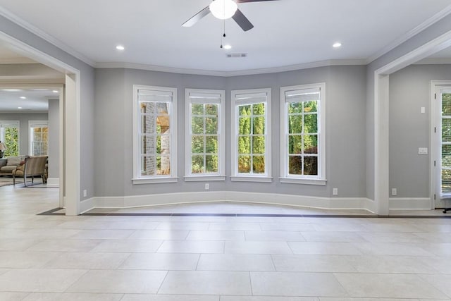 interior space with ceiling fan, ornamental molding, and a wealth of natural light