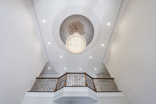 interior details featuring an inviting chandelier and ornamental molding