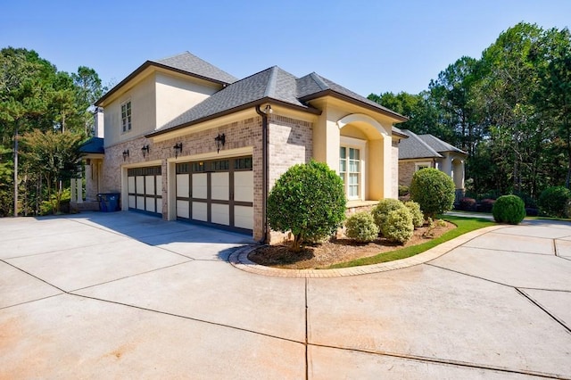 view of side of property with a garage