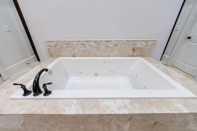 bathroom with tiled tub