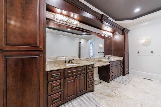 bathroom with vanity and ornamental molding