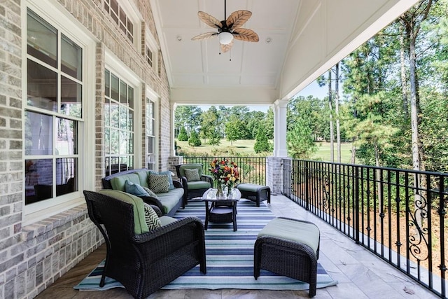 view of patio / terrace with an outdoor living space and ceiling fan