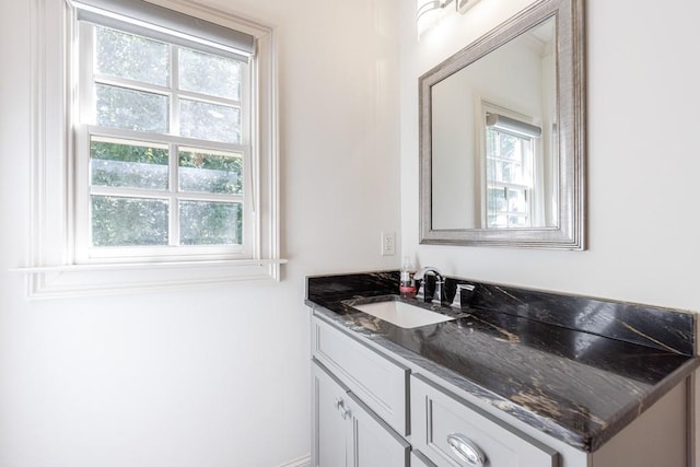 bathroom with vanity and a healthy amount of sunlight