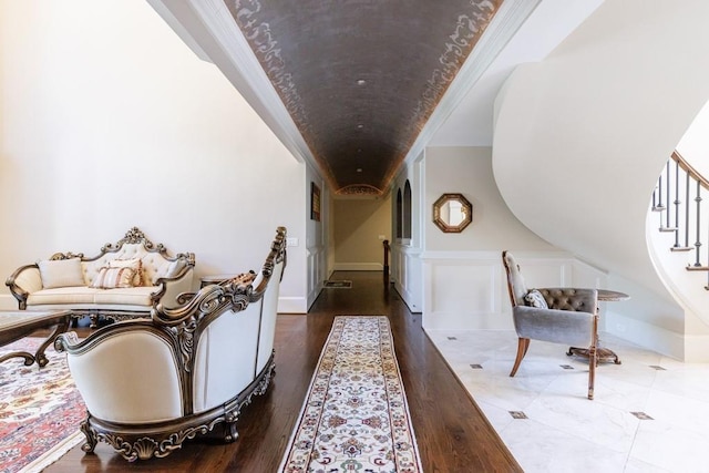 corridor with crown molding and dark hardwood / wood-style flooring