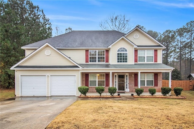 view of front of home featuring covered porch and a front yard