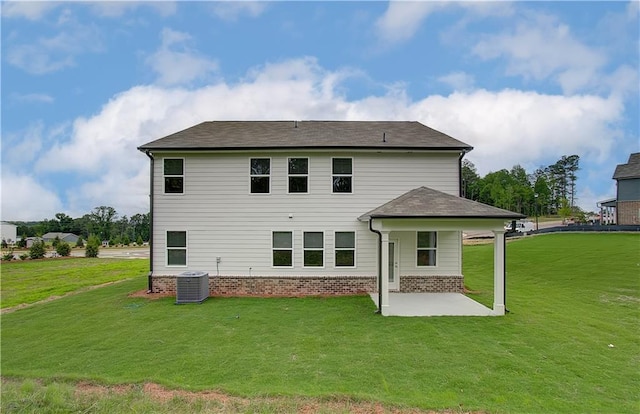 back of property with a yard, central AC, and a patio