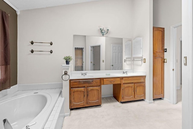 bathroom with vanity and tiled bath