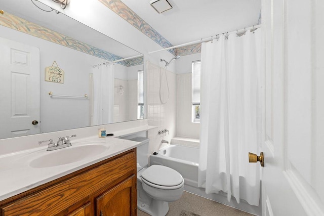 full bathroom featuring shower / tub combo with curtain, vanity, and toilet