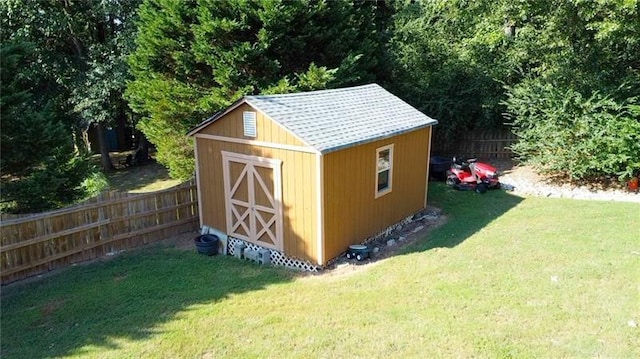 view of shed with fence