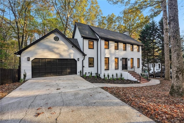 view of front of property with a porch and a garage