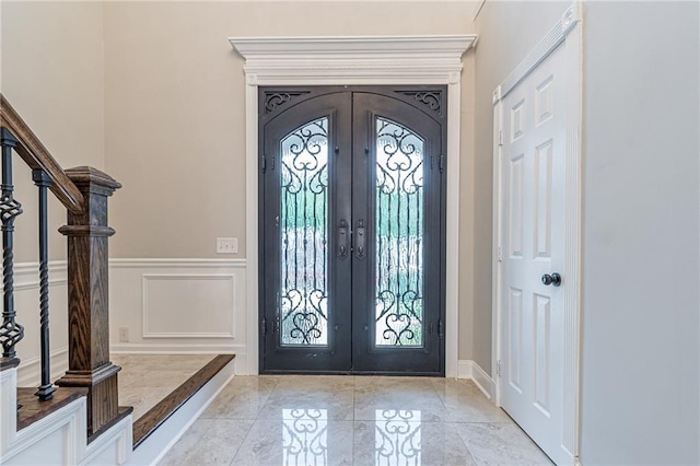 entrance foyer featuring french doors