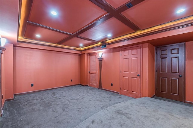 carpeted home theater with coffered ceiling